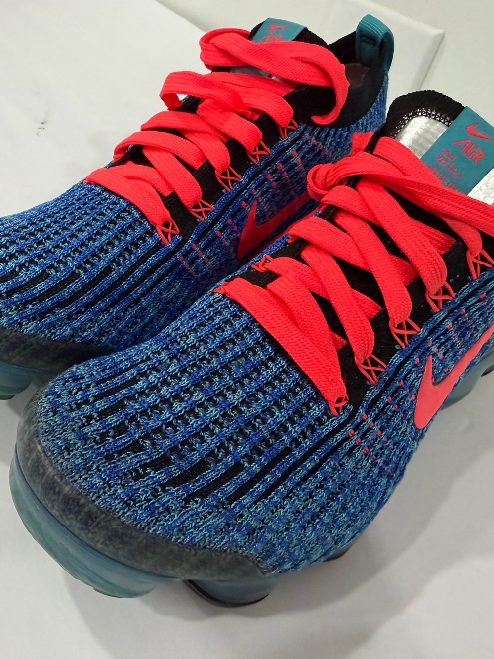 Nike Kids Blue Flyknit Sneakers with Bright Pink Accents